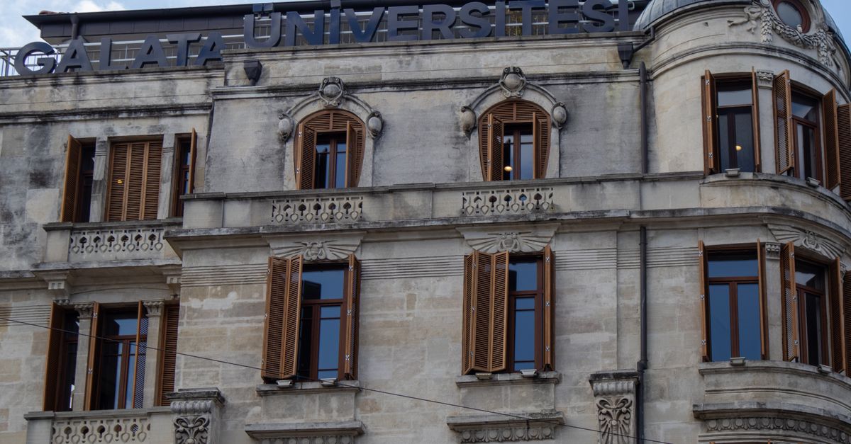 View of Galata University building's classic architectural facade with detailed stone work in Istanbul, Turkey.